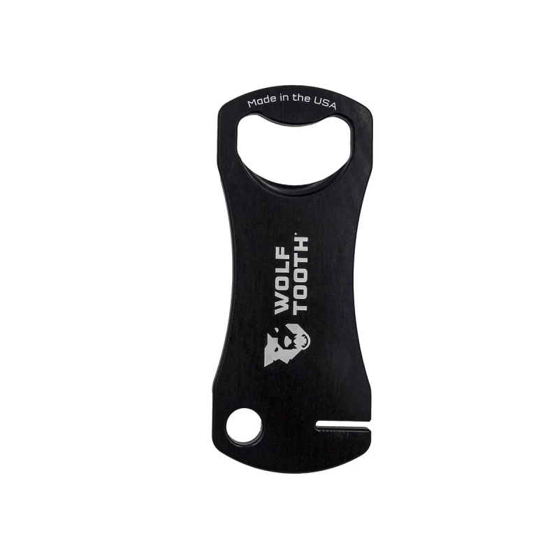 Czarny klucz Wolf Tooth Components do prostowania tarcz hamulcowych z funkcją otwieracza do butelek.